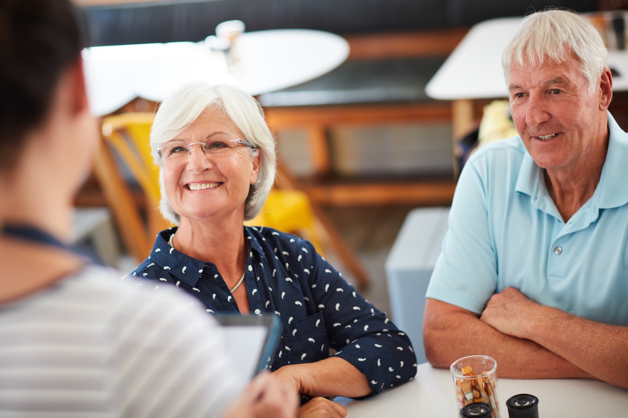 Travel advisor reviewing plans with a client
