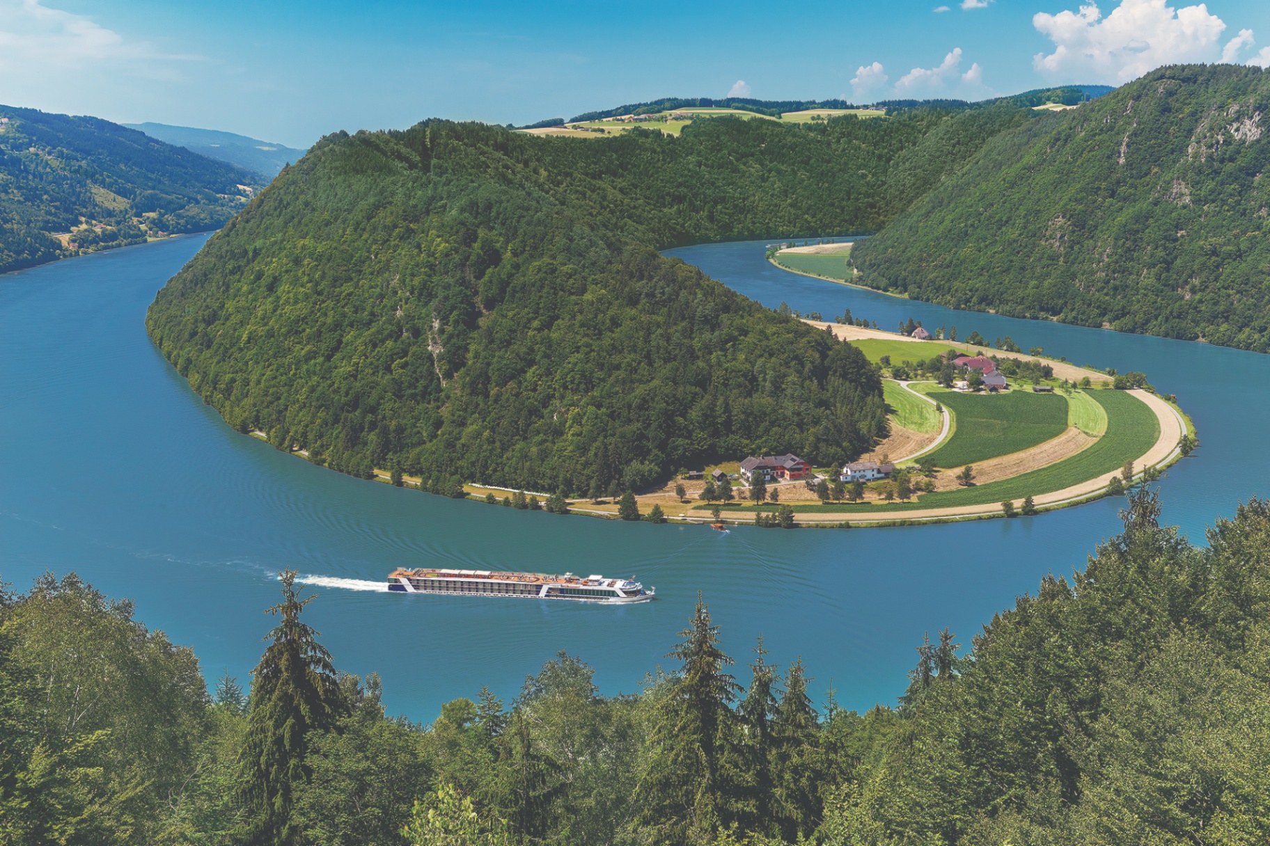 Scenic river cruise through green valleys